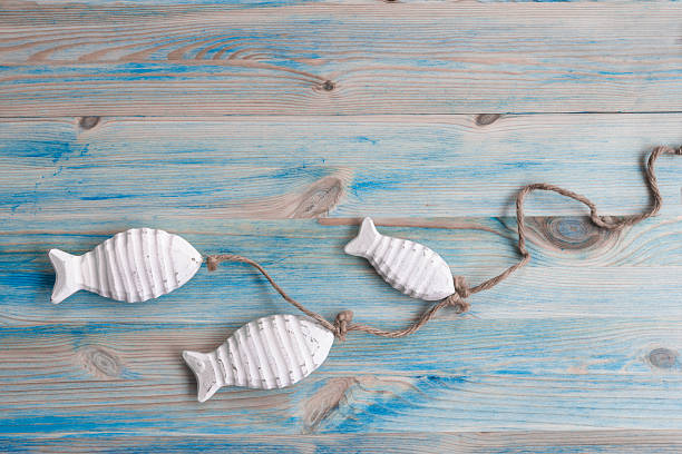 istock Marine background with wooden fish 514563474