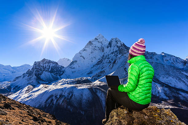 istock Young woman using laptop in Himalayas, Nepal 514563516