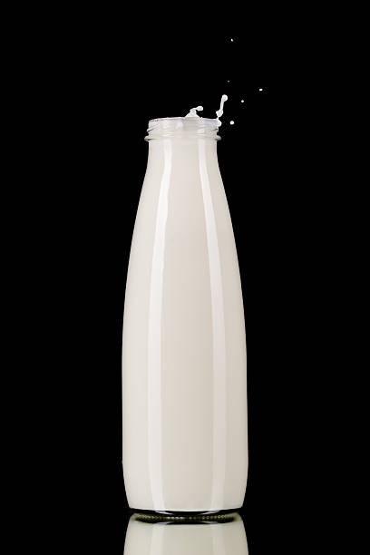 Bottle of milk on black stock photo
