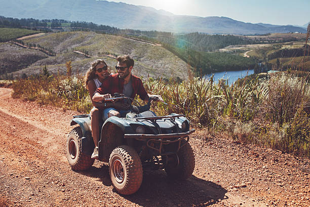 istock Happy couple riding on a quad bike 514567812