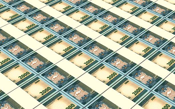 istock Mauritanian ouguiya bills stacks background. 514568860