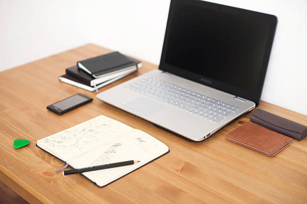 istock Office workplace with laptop and notebook on wood table 514570058