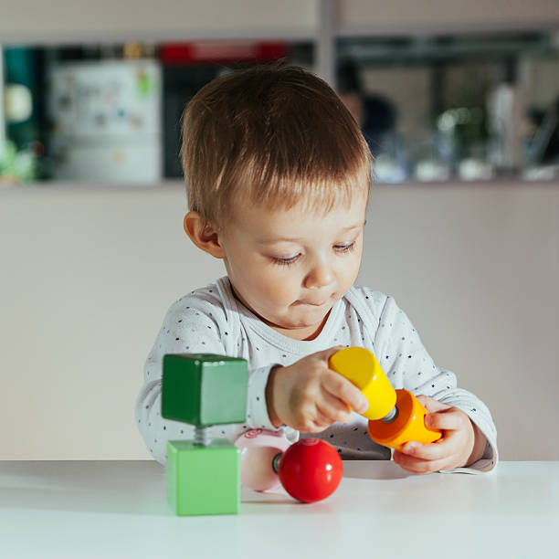 istock Little Boy Is Playing With Toys 514570570