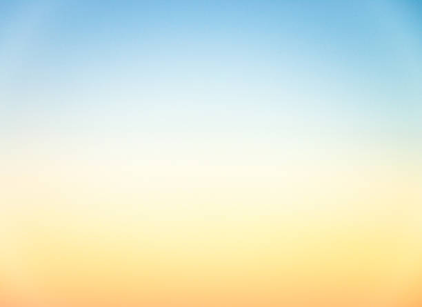 Graduated empty sky horizon at sunset - genuine photograph An image, taken at sunset, of clear sky, with natural graduation of colours near the horizon, from blue at the top, to yellow / orange at the bottom. color gradient photos stock pictures, royalty-free photos & images