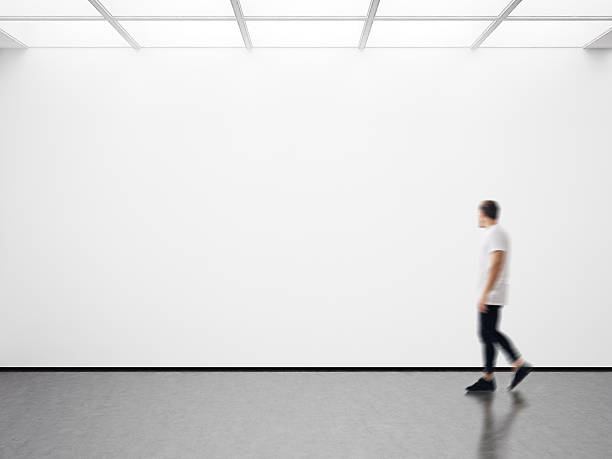 istock Photo of man in modern gallery looking at the empty 514572308