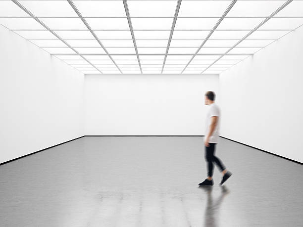istock Photo of student in modern gallery looking at the empty 514572354