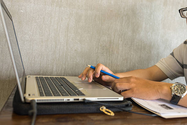 istock Hand of man using laptop on his business room 514573480