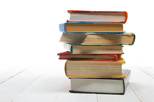 istock Stack of books at wooden shelf isolated on white background 514575132