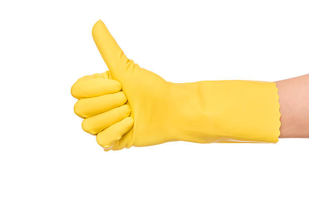istock OK sign hand in a yellow glove 514575304
