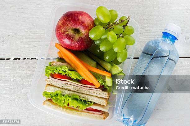 Lunchbox With Sandwich Vegetables And Fruit Bottle Of Water Stock Photo - Download Image Now