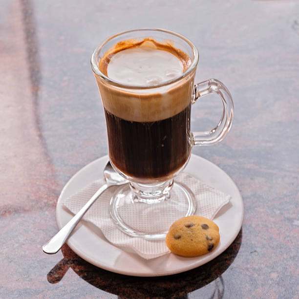 istock Cup of hot latte art coffee on the marble table 514579994