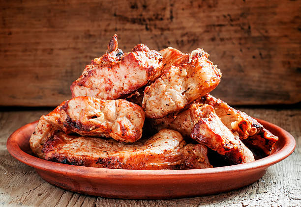 istock Pieces of shish kebab, grilled, on a clay dish 514580942