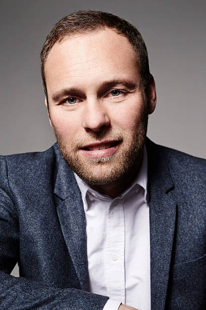 istock Businessman in suit looking at camera 514580996