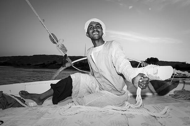 istock Egyptian man sailing a felucca on Nile River 514582716