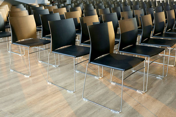 istock Rows of empty chairs prepared for an indoor event 514583112