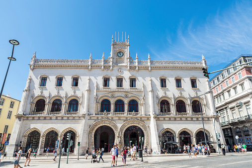 Lisbon, Portugal - August 18, 2014: Facade of the station of Rossio in Lisbon, Portugal. In the image the activity of the city is with people and tourists