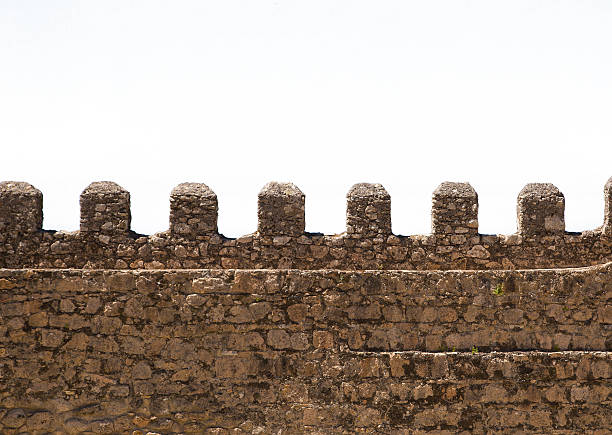 istock Part of old brick and stone wall isolated on white 514585223
