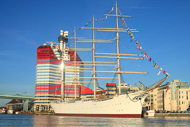 figurehead on the bow of a full-scale replica of a viking ship, moored in port