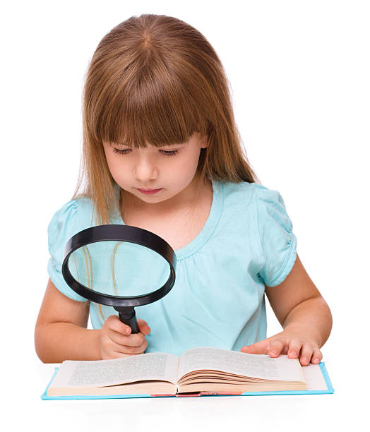 istock Cute girl is reading book 514585479