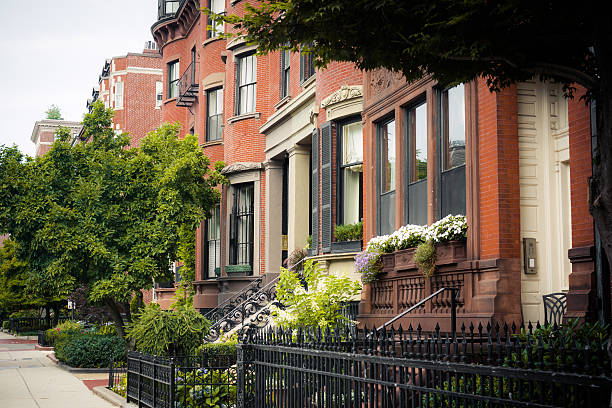 istock Residential structures along street in Boston, MA 514585497