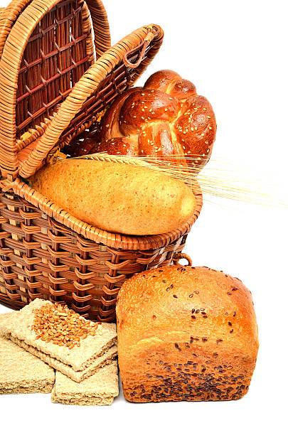 istock Fresh bread and wheat ear in the basket 514586045