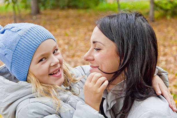 istock Smiling mother and daughter in autumn 514610799