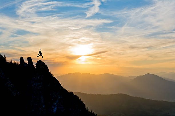 istock hiker on the peak at sunset 514611481