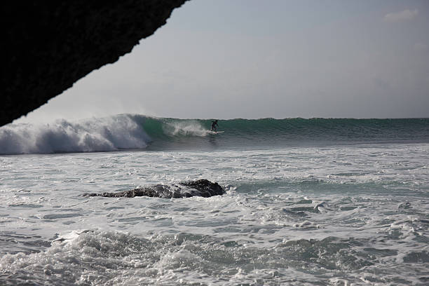 istock Surfer is riding a perfect wave in Balangan bay 514616575