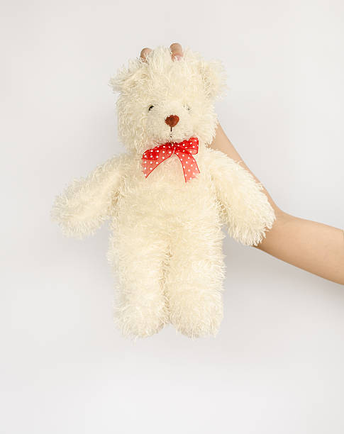 istock asian teen holding a  bear doll. 514616633