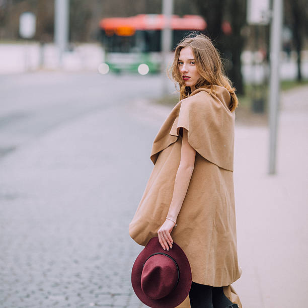 istock Woman standing on the park background with flowers 514617822