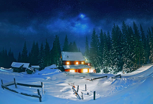 Wooden house in winter forest , Carpathian stock photo