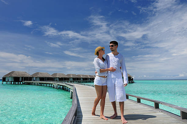 istock Couple on a beach jetty at Maldives 514619138