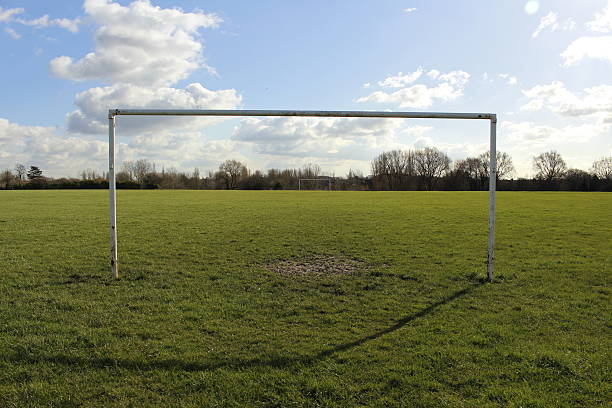 istock Goal Posts On A Field In The Sun 514620556