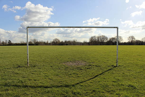 istock Goal Posts On A Field In The Sun 514620820