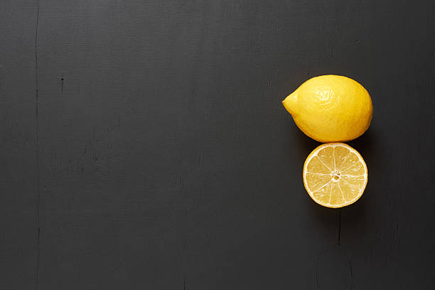 istock Lemon and lemon slice. Clearance black background. 514621136