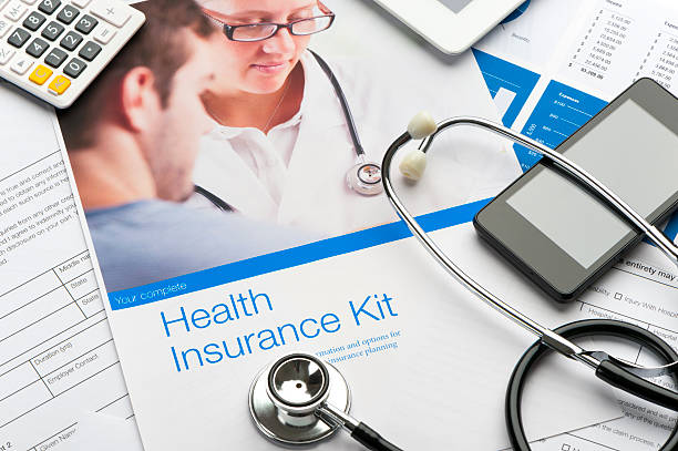 istock Close up of a heath insurance kit with stethoscope. 514621496