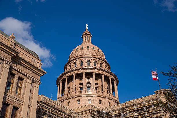 istock The Texas State Capitol Building and Flags 514622490