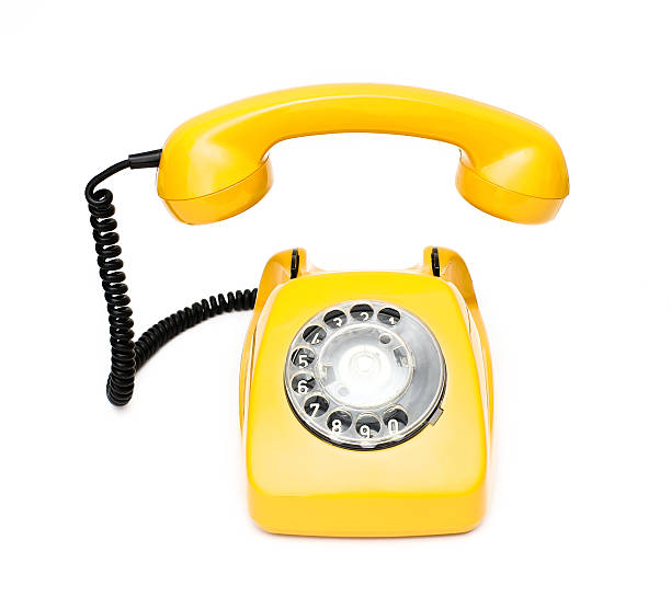 istock Yellow retro telephone isolated on white background. 514623026