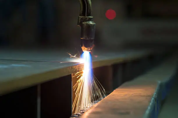 Oxygen torch cutting sheet metal.