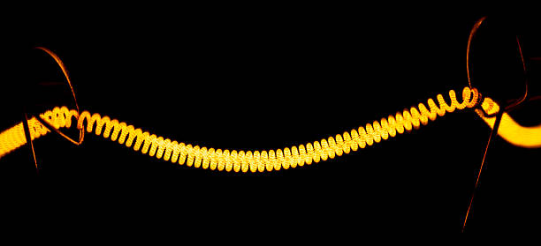 istock filaments in a vacuum inside of a bulb 514626482