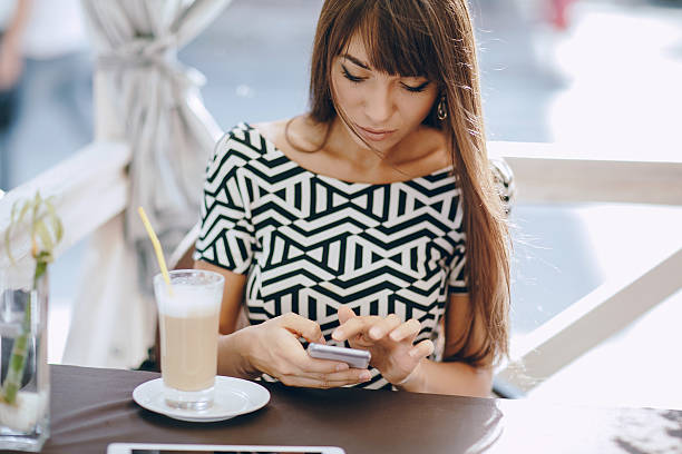 istock girl with phone 514626676