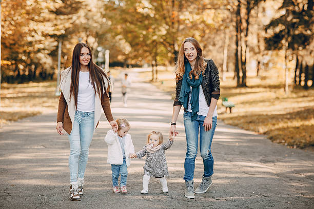 istock young family walking in the park 514627248