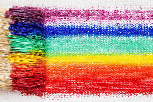 istock Paintbrush bristle closeup and multicolor rainbow brush strokes 514627842