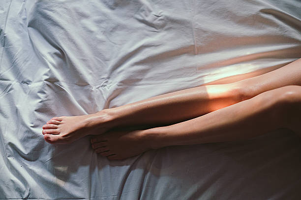 istock Light spot on girls legs 514630648