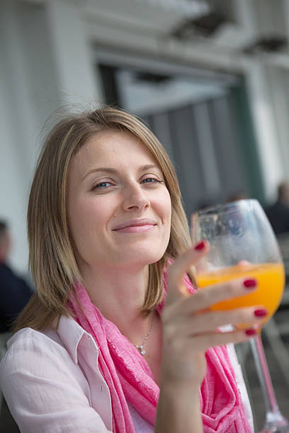 Woman holding orange juice