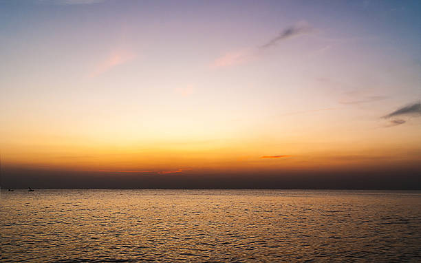 istock twilight sky with colorful sunset and clouds at beach 514632592