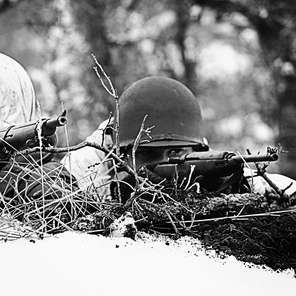 World War 2 soldiers taking aim on their target.