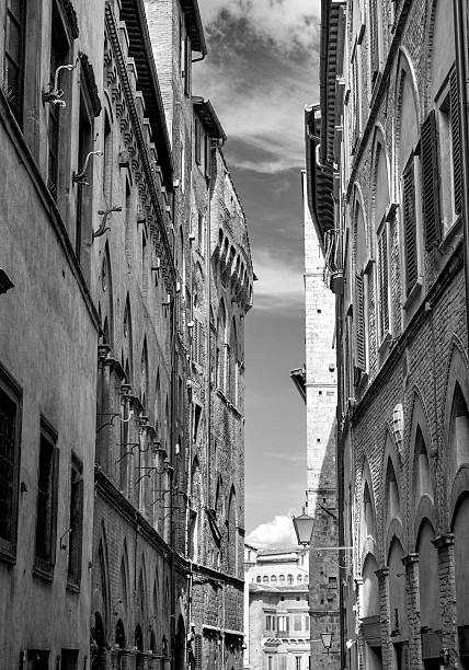 istock Siena, old city alley view. BW image. 514633927