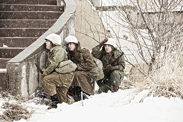 istock Three US World War II Soldiers Fighting In the Streets 514634748