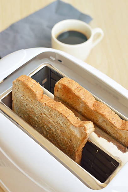 istock Toaster and two slices of bread ready to serve 514634822